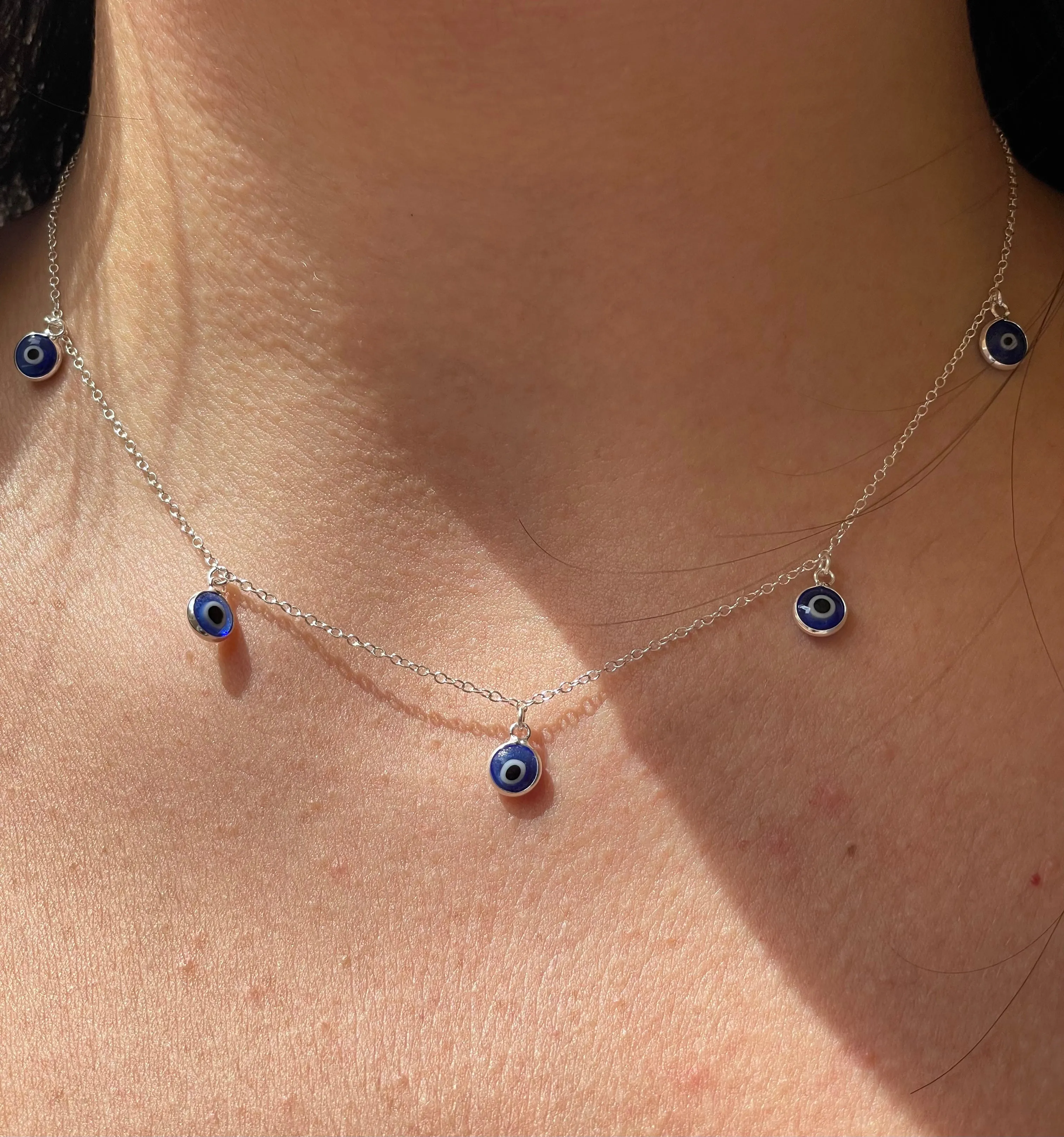 Set collana, bracciale e orecchini con occhio di Allah blu